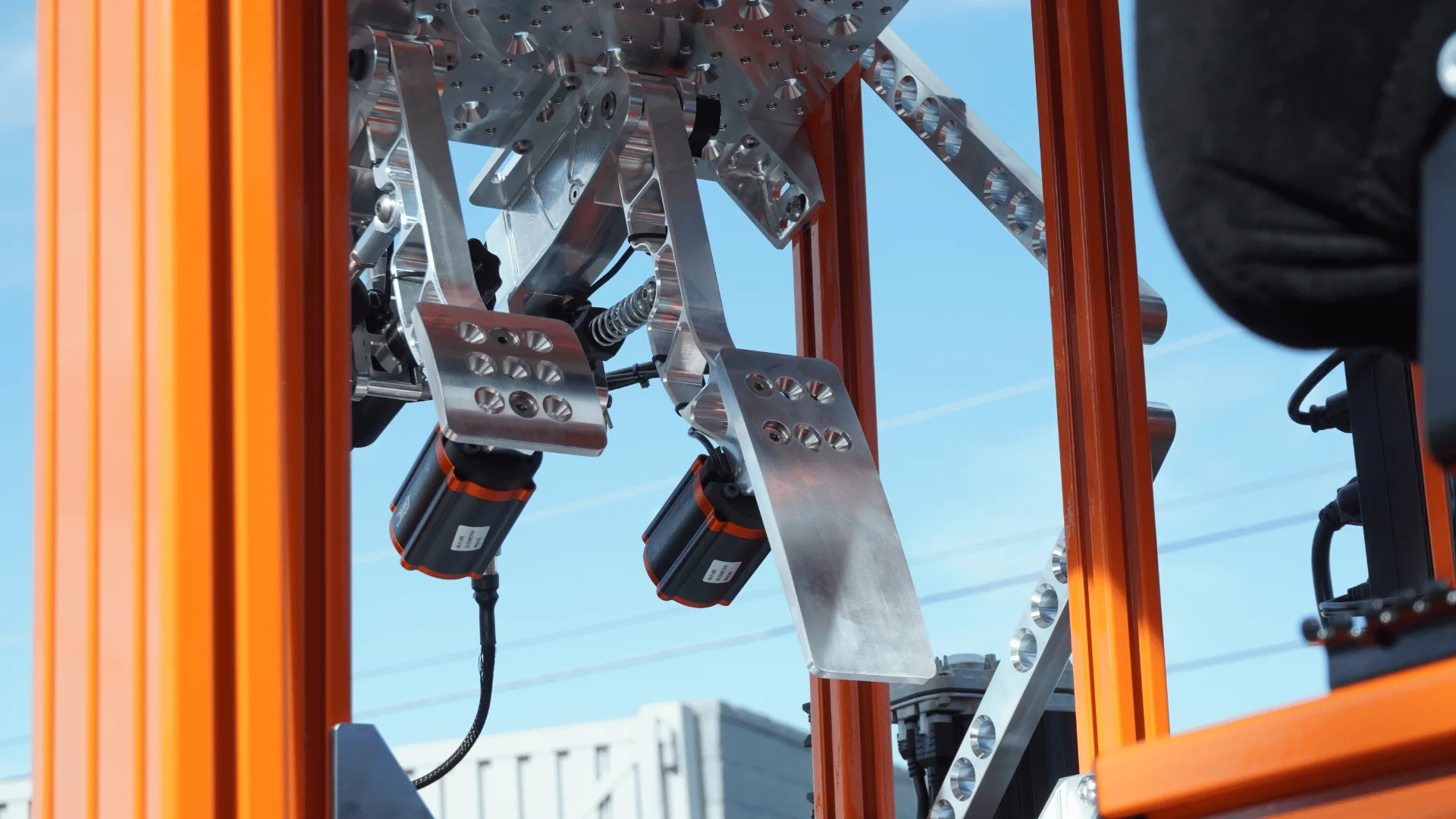 Sim Coaches hydraulic pedal assembly mounted in a simulator chassis